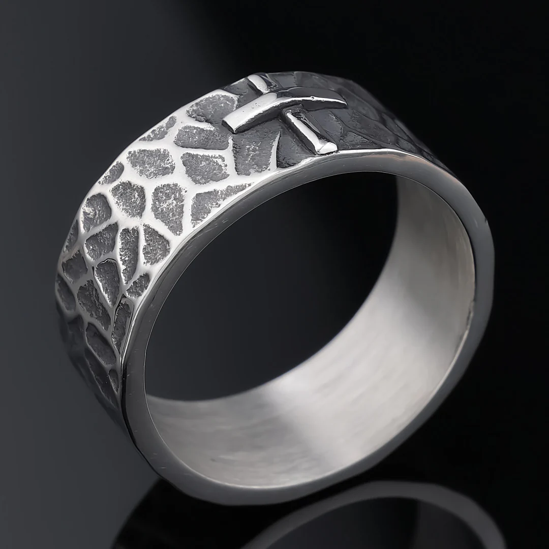 Hand-carved stone cross ring carries His gentle protection