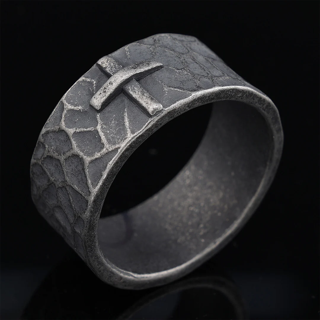 Hand-carved stone cross ring carries His gentle protection