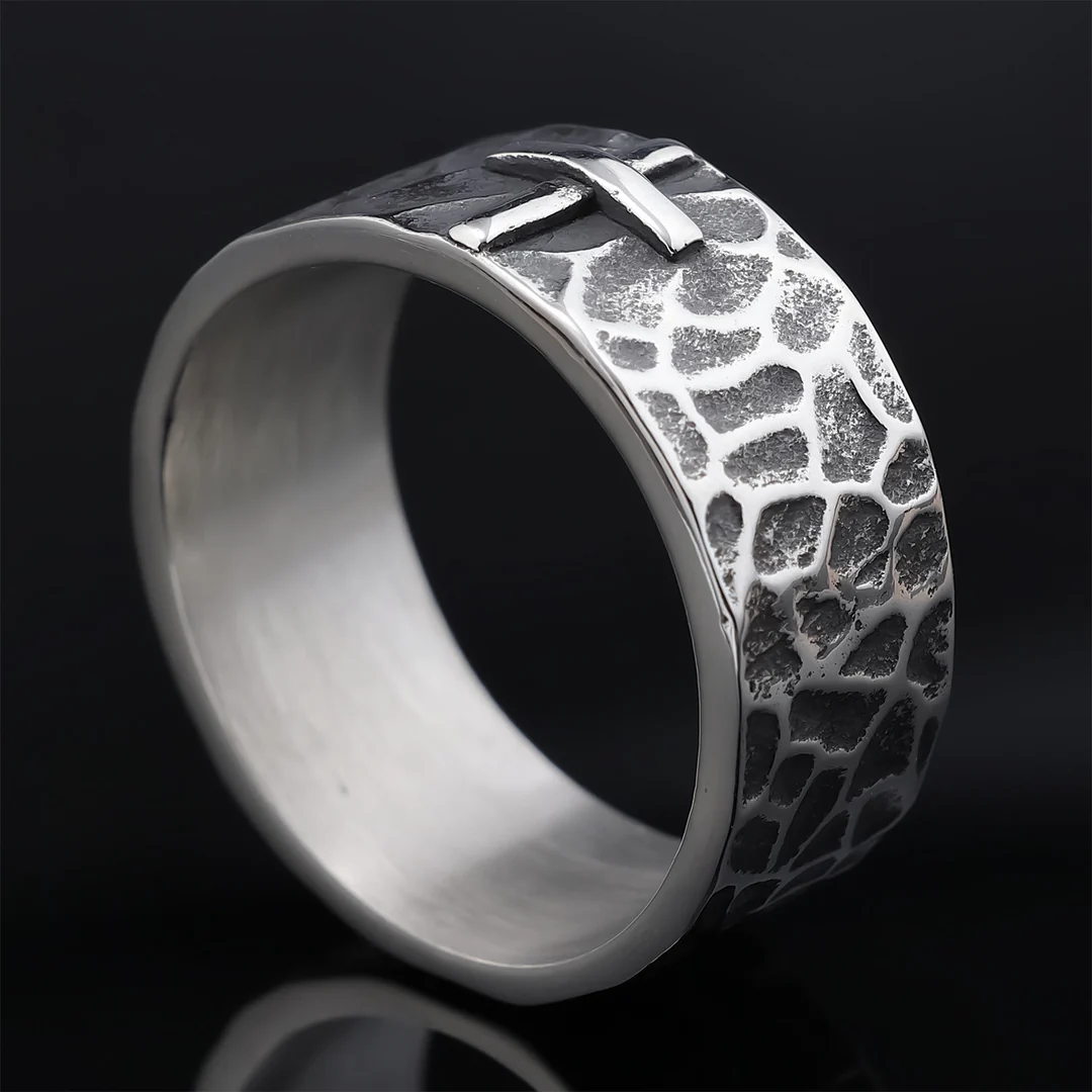 Hand-carved stone cross ring carries His gentle protection