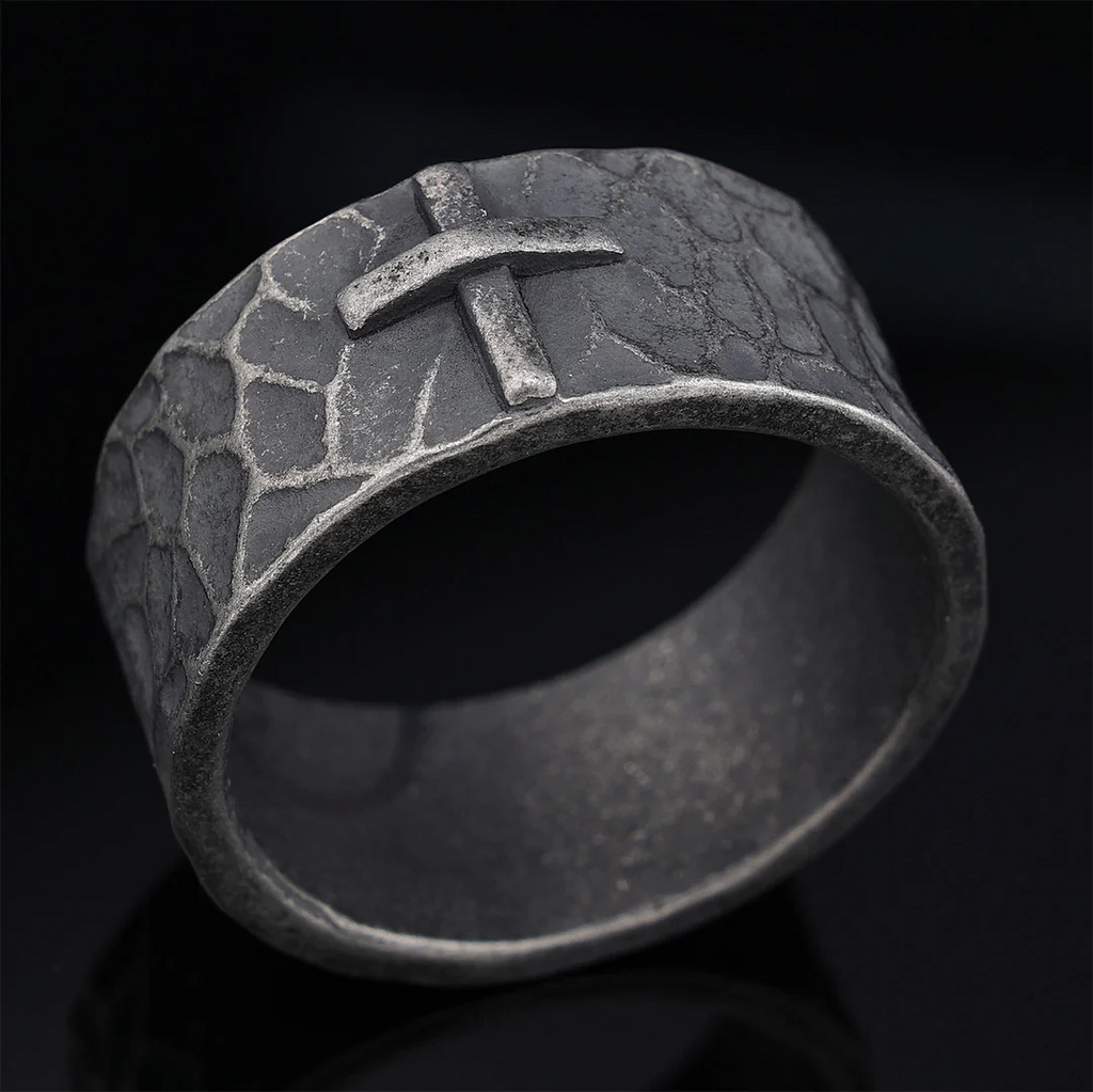 Hand-carved stone cross ring carries His gentle protection