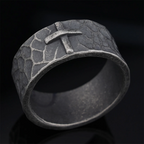 Hand-carved stone cross ring carries His gentle protection