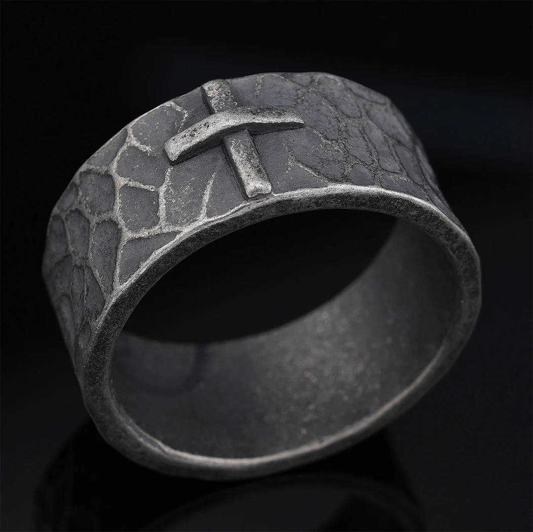 Hand-carved stone cross ring carries His gentle protection